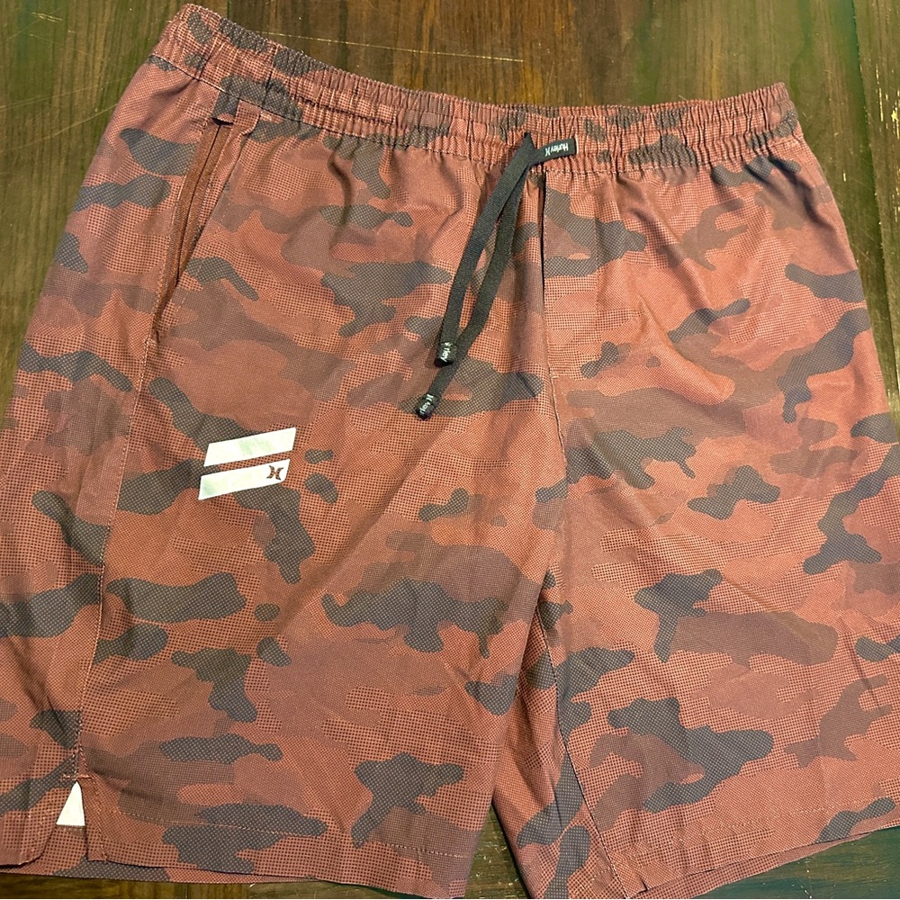 Size L Hurley Camo Athletic Shorts 4 pockets, one zipper pocket. Worn Once